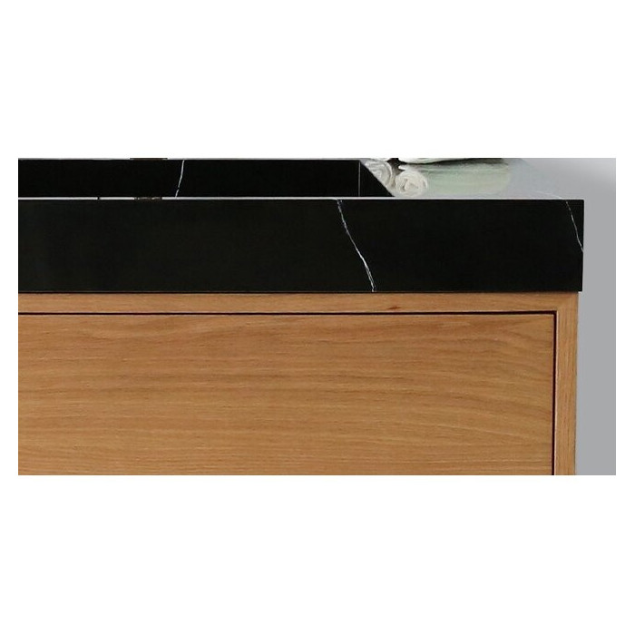 The sink is mounted on the VITRAZ furniture, 914 x 559 mm, black marble.